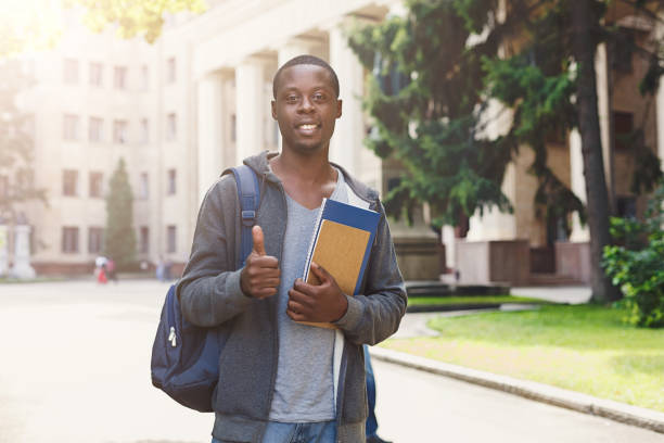 istock African-american student with books at university 962226196