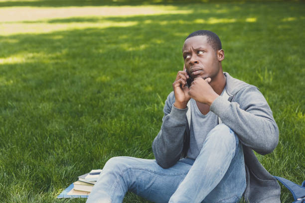 istock Serious african-american man talking on phone 962226372