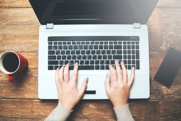 istock Female hands typing on a laptop keyboard 962226936