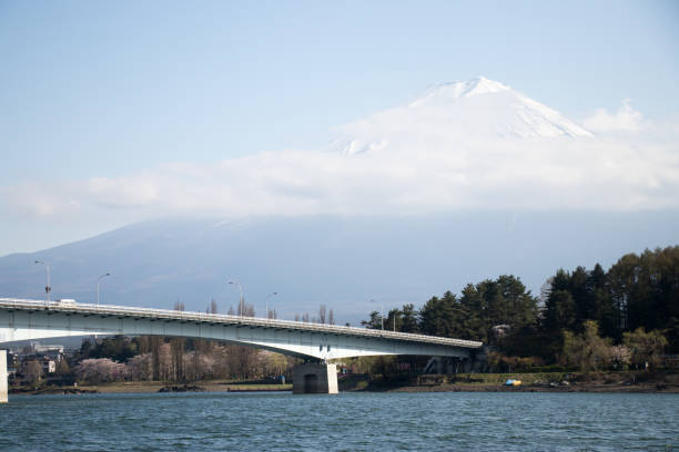 istock Mountain Fuji with snow cap as background and bridge wit hlake kawaguchiko as foreground. Mount Fuji is the famous travel destination in japan 962229612