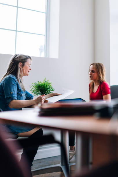 istock A teacher and an adult student looking at a document 962234504