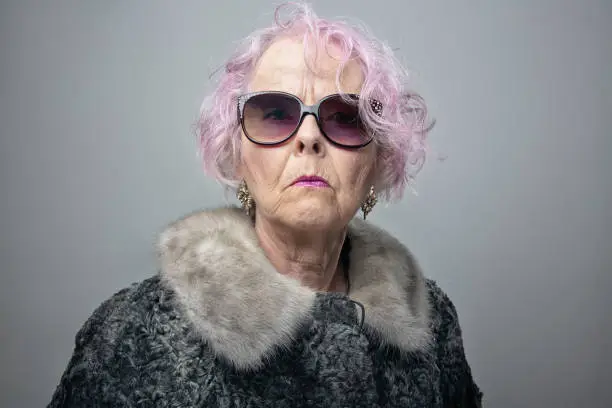 Photo of eccentric senior lady with cool attitude portrait