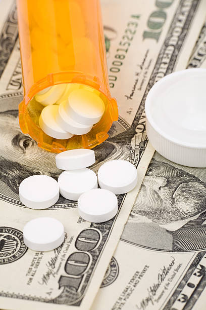 istock Medicine pills and dollar 96224548