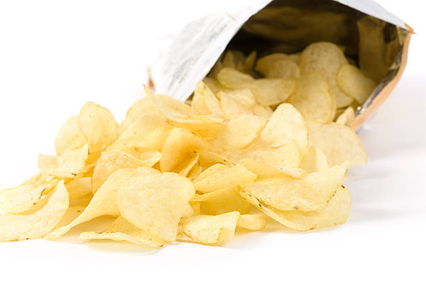 istock Bag of potato chips spilled onto the table 96226083
