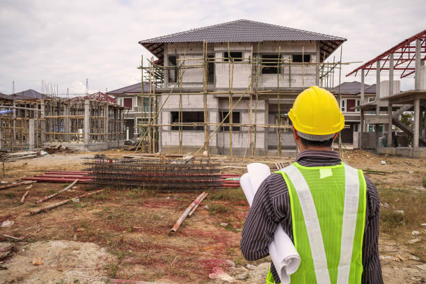 istock Asian business man construction engineer worker at house building site 962263788