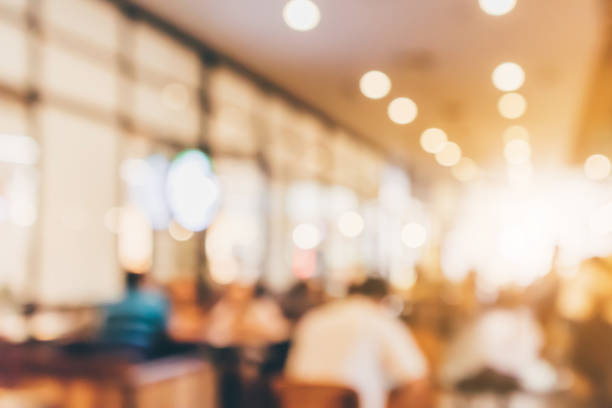 istock Restaurant cafe or coffee shop interior with people abstract defocused blur background 962263926