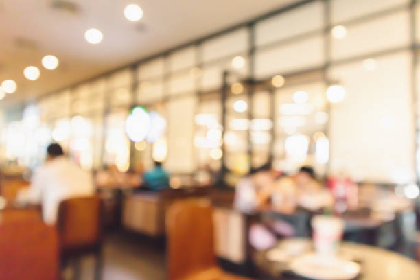 istock Restaurant cafe or coffee shop interior with people abstract defocused blur background 962263932