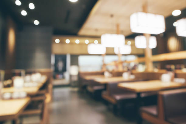 istock abstract blurred cafe restaurant with bokeh lights defocused background 962263944