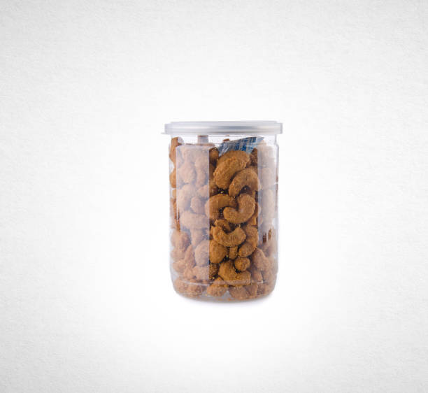 istock cashew nuts in jar on the background 962273196