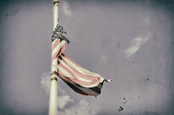 istock Tattered American Flag Dark Sky 962279344