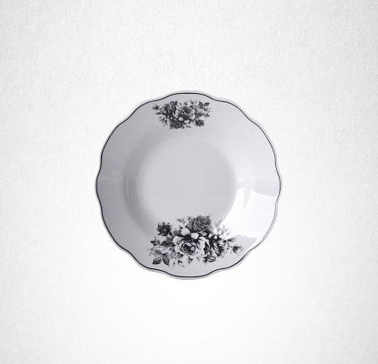 Group of white color bowls and plates over white marble table