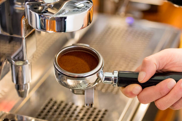 istock barista showing full espresso portafilter 962283468