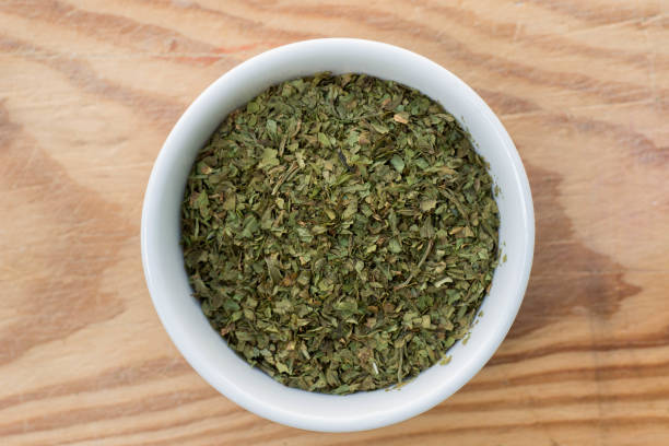 istock dried ocimum leaves in small bowl 962287068