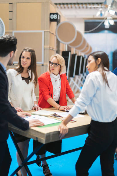 istock Business team working in an exhibition hall 962289512