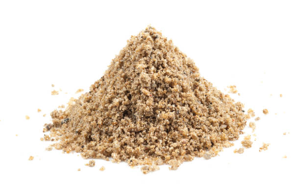 istock Pile of sand isolated on a white background 962290726