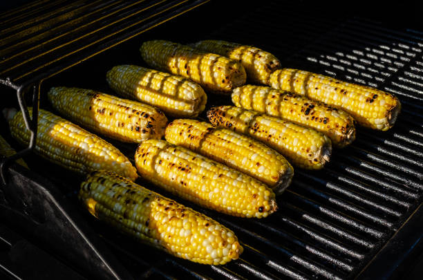 istock A dozen cobs of corn on the BBQ grill, showing delicious grill marks. 962290758