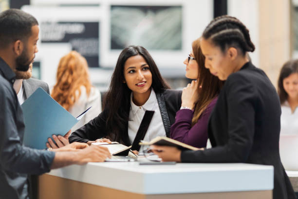 istock Business people attending an exhibition 962293644