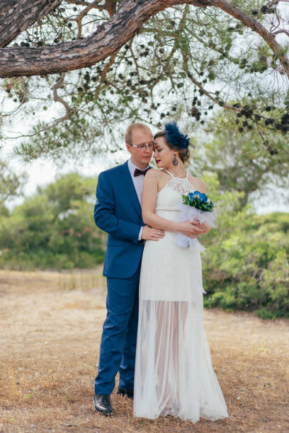 istock Portrait of wedding couple 962293692