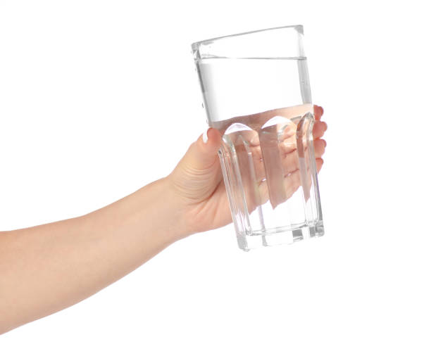 istock Glass of water in hands 962294052