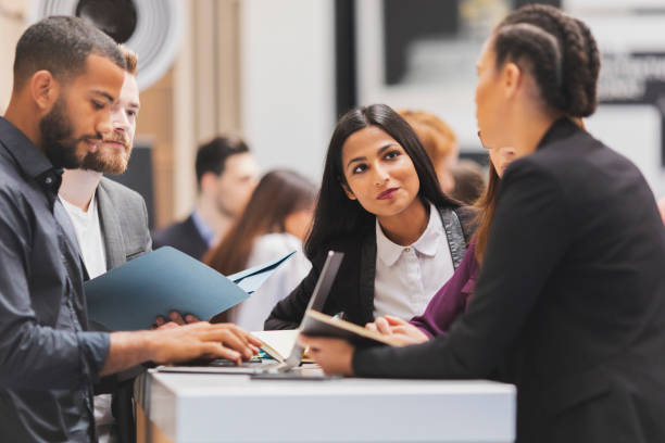 istock Business people attending an exhibition 962299106