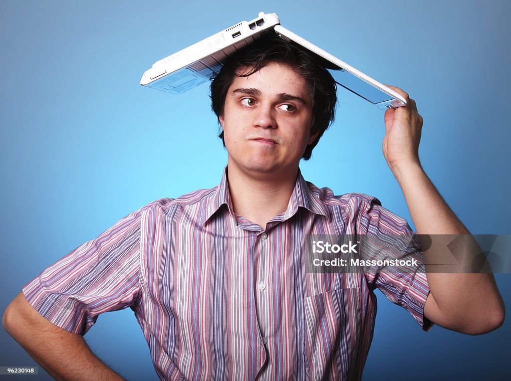 Boy with laptop on had  Adult Stock Photo