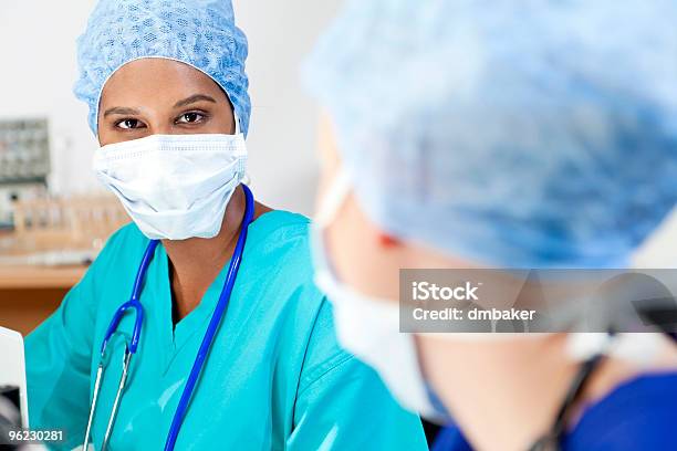 Asian Female Scientist With Her Colleague In Laboratory Stock Photo - Download Image Now