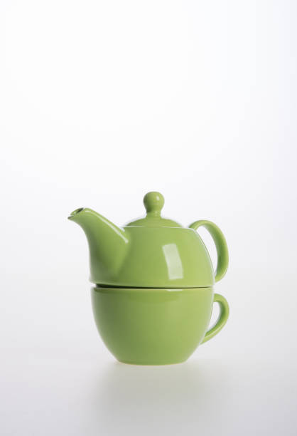 istock Tea pot set or Porcelain tea pot and cup on background 962309594