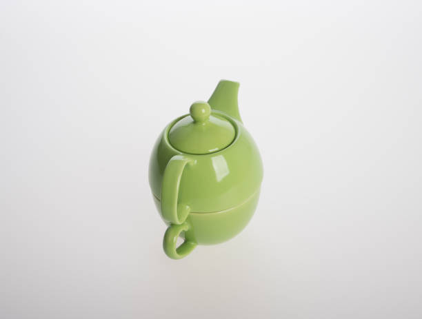 istock Tea pot set or Porcelain tea pot and cup on background 962309636