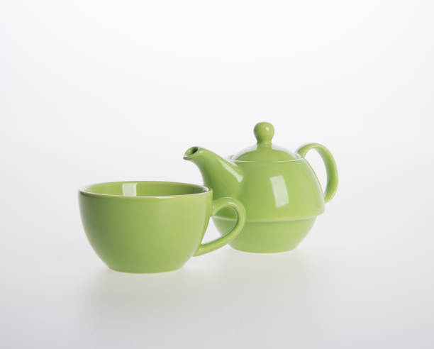 istock Tea pot set or Porcelain tea pot and cup on background 962310360