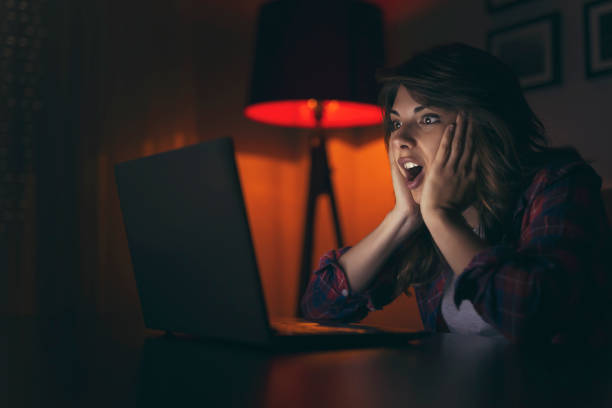 istock Woman watching a movie on a laptop computer 962314752