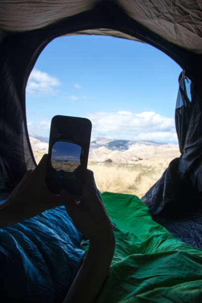 istock Taking photos out of the tent using smart phone 962318762