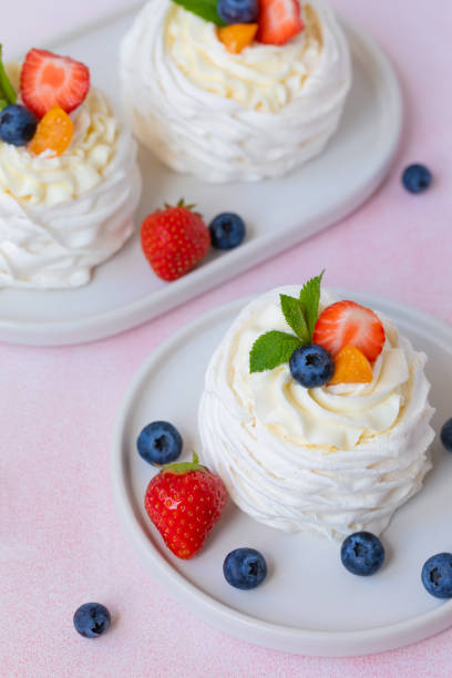 istock Meringue, Pavlova cake with strawberries, blueberries and mint 962322502