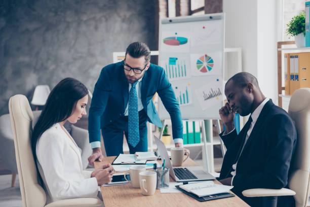 istock Stylish, handsome, attractive, dissatisfied unhappy man in glasses having problem with his colleagues, they did not reach a consensus, working routine, process in work station, place 962322718