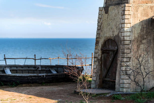 istock Close up lighthouse building near sea 962323848