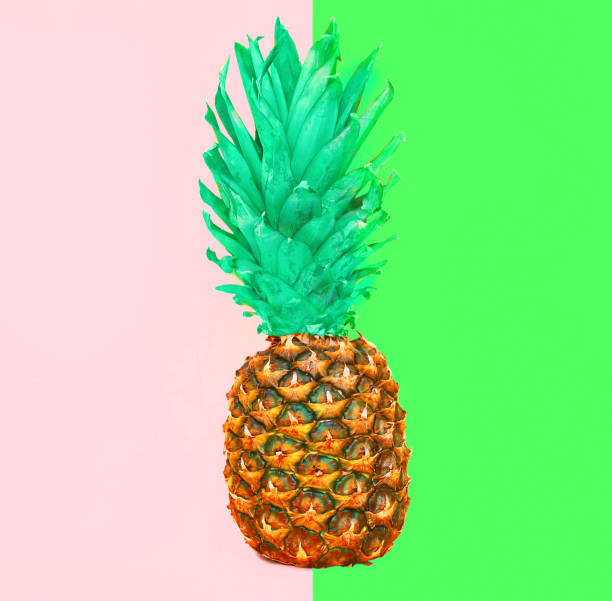 istock Pineapple fruit on colorful pink green background, ananas photo 962326568