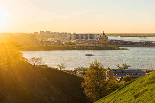 View from the high on Oka River, Alexander Nevsky Cathedral, riverbank and Nizhny Novgorod Stadium at golden hour sunset time in summer