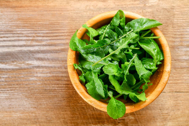istock Fresh green home arugula leaves, rucola. Salad. 962335092
