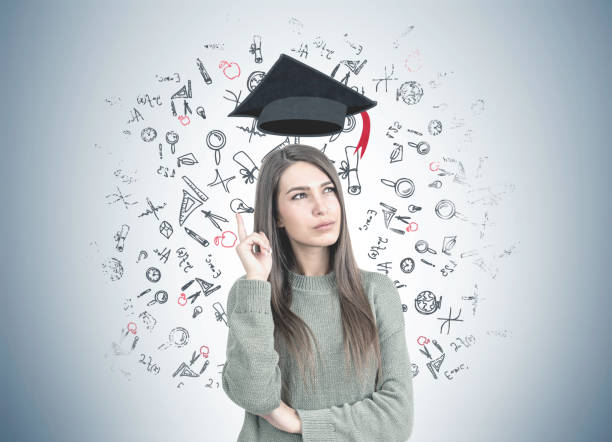 istock Thoughtful woman in green pointing up, education 962335134