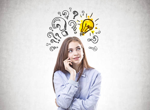 istock Dreamy young woman in a blue shirt, answer 962338366