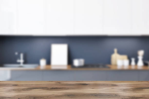 istock Gray kitchen countertop with a small poster blur 962339456