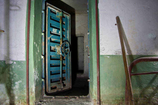istock Blue rusty hermetical door of old abandoned Soviet bomb shelter 962340098