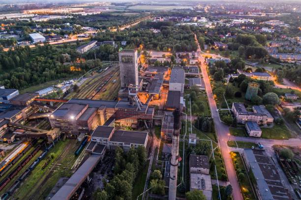 istock Aerial drone view black coal mine at dusk. 962340312