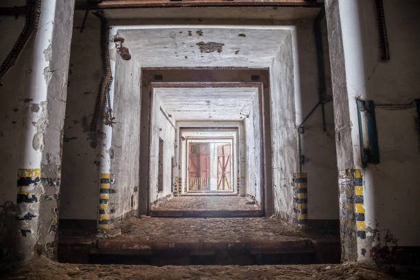 Entrance gateway corridor of abandoned and rusty old soviet military bunker warehouse of warheads