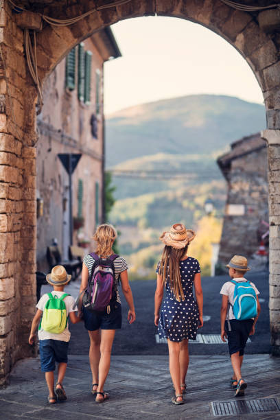 istock Family enjoying sightseeing small italian town 962340904