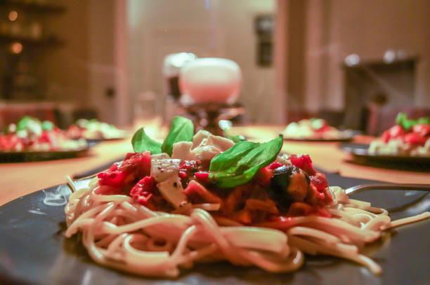 istock Plate of spaghetti pasta with tomato, basil and mozarella 962347856