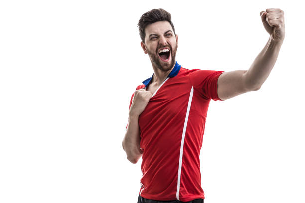 istock Fan / Sport Player on red uniform celebrating on white background 962353286
