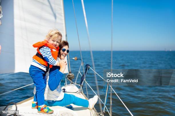 Family Sailing Mother And Child On Sea Sail Yacht Stock Photo - Download Image Now