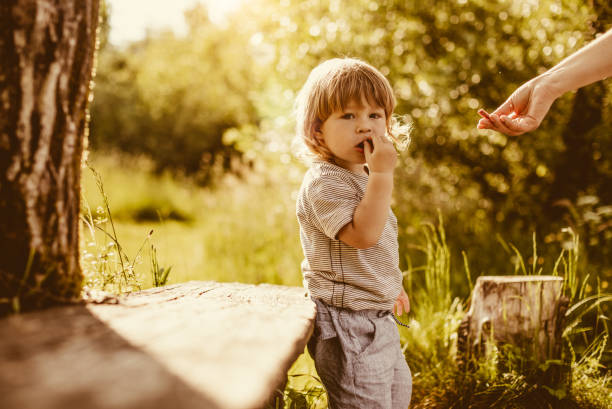 istock Mother With Son Playing Outdoors 962358464