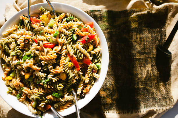 istock Colorful noodles macaroni outdoors in large bowl 962362544