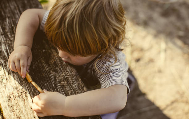 istock Toddler Playing Outdoors 962375330